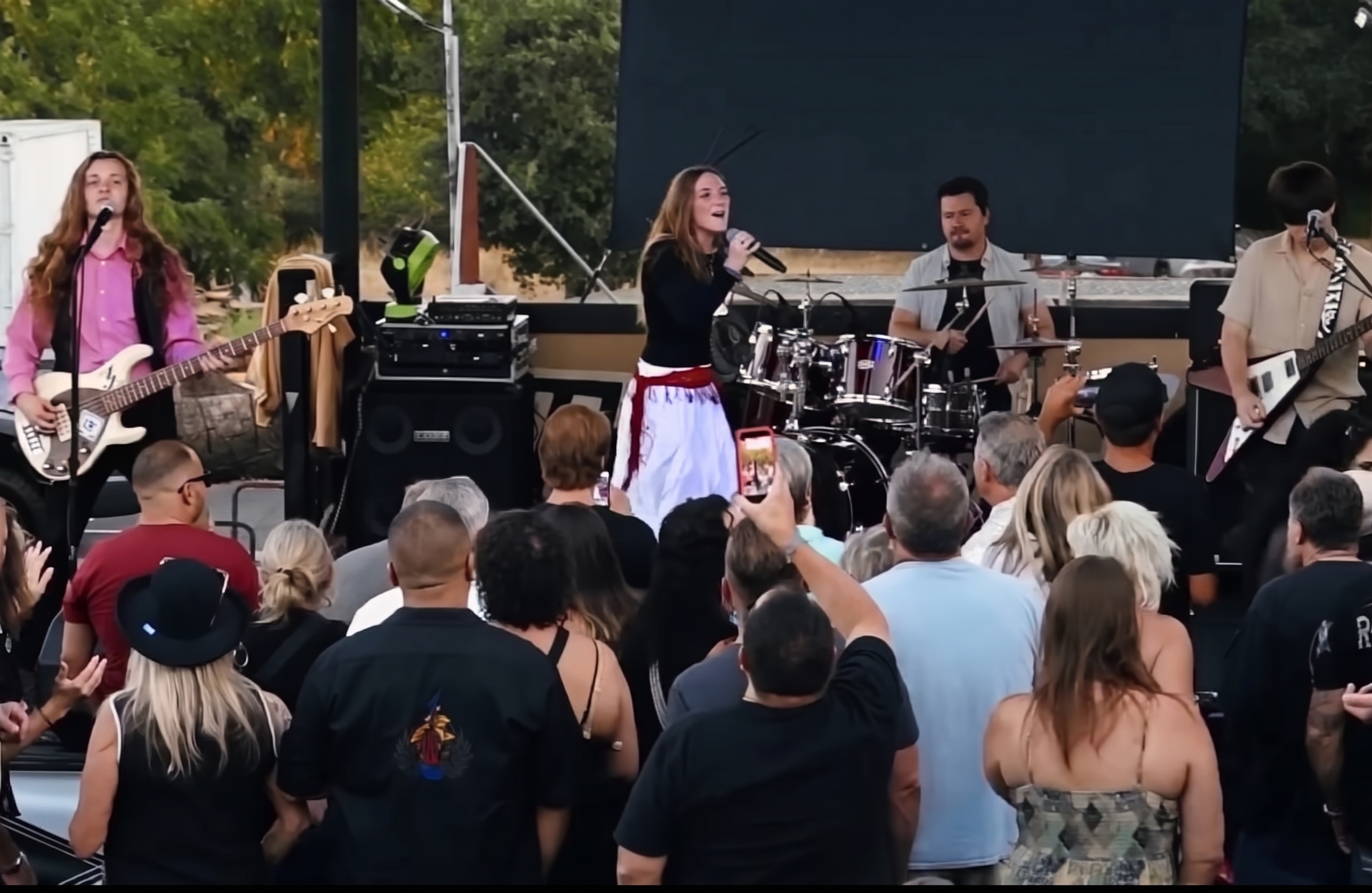 Lead vocalist and band performing to a full crowd at The Bird